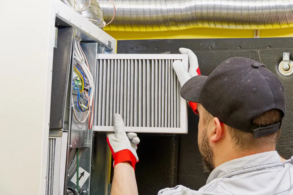 Close-up of ducting, flexible ducting, ac units, thermostats materials lined up in a warehouse.
